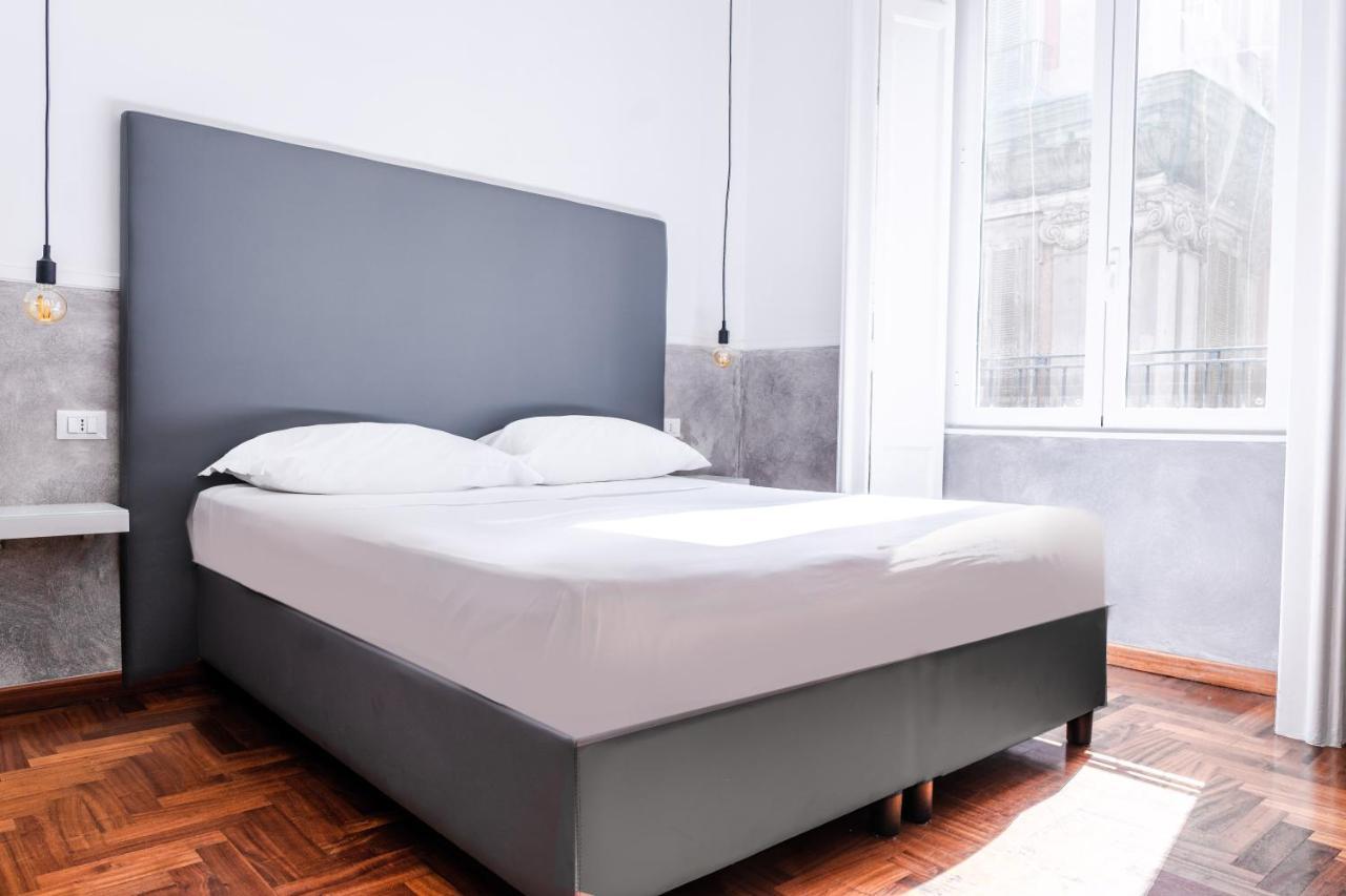Toledostop Naples Extérieur photo A double bed
